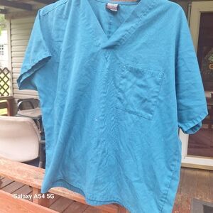 Cherokee scrub top. Women's fits like a small  Caribbean Blue